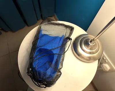 Pair of blue snorkeling fins with mesh carry bag - 36-38 size