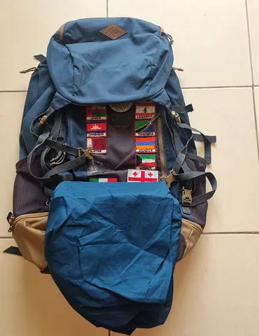 Quechua 70 litre hiking/backpacking rucksack with rain cover in good condition.