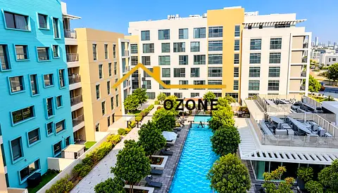 Elegant Pool-Facing 1BR | Bright Interiors | Balcony | Uptown Al Zahia