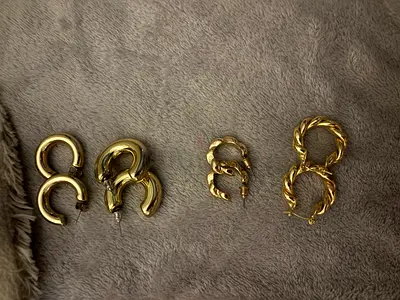Set of four pairs of gold-tone hoop earrings — various styles, good used condition