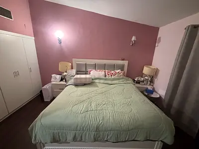 King bed with upholstered headboard and side tables and vanity good condition