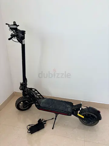 Electric kick scooter with charger — well maintained, ready to ride