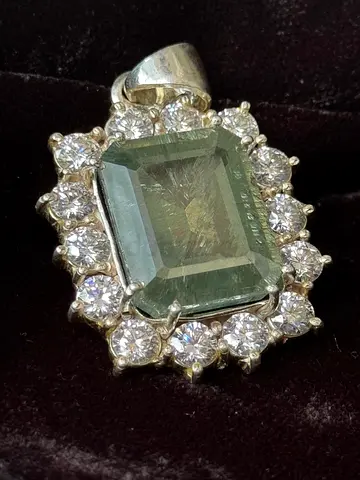 Above 50 Carat, Emerald-cut green Moissanite Diamond pendant with halo of round Moissanite .75 Carat
