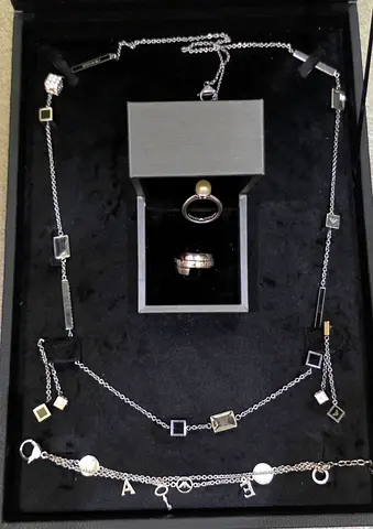 Armani-Sterling Silver Necklace Set with Two Rings and Charm Bracelet - Good Condition