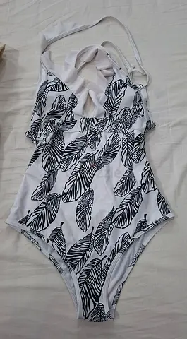 White one-piece women's swimsuit with black leaf print, size (S)