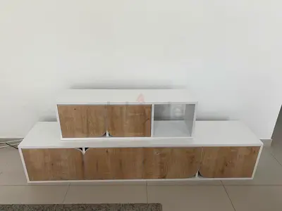 Low-profile modern TV entertainment unit with wood-effect doors