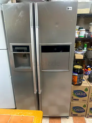 LG Side-by-Side Stainless Steel Refrigerator with Water/Ice Dispenser - Good Working Condition