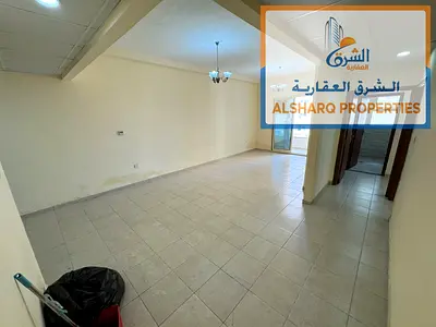 A two-bedroom apartment with a living room, featuring premium specifications and a prime, vibrant location in the Al Amra area, Emirates City—situated