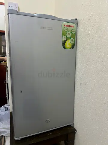 Used single-door upright freezer in silver - good working condition