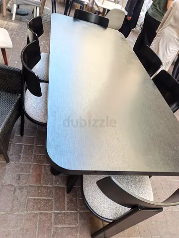 Modern black dining table with 6 matching chairs - good condition