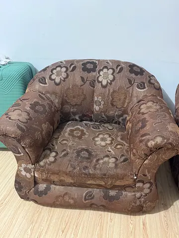 Single brown floral upholstered arm sofa in good used condition