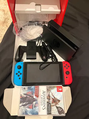 Brand new ,Nintendo Switch console with Joy‑Cons, dock, charger and Assassin's Creed game