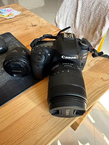 Canon EOS DSLR with 18-135mm and 50mm lenses (body + 2 lenses)