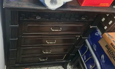 Dark wood 5 drawer dresser with carved detailing