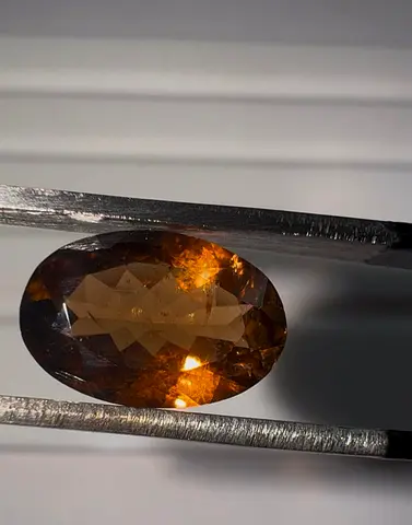 Natural oval brown-orange faceted Tourmaline gemstone (loose) - high clarity
