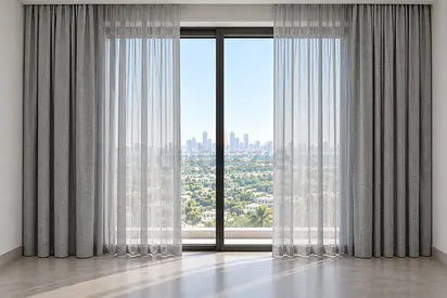 Grey full-length curtains with sheer inner panels - set for large window