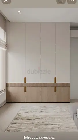 Modern built-in wardrobe with wood accent panels