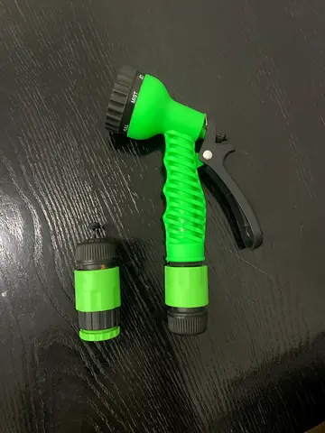 Green multi-function garden hose nozzle with adapter - lightly used
