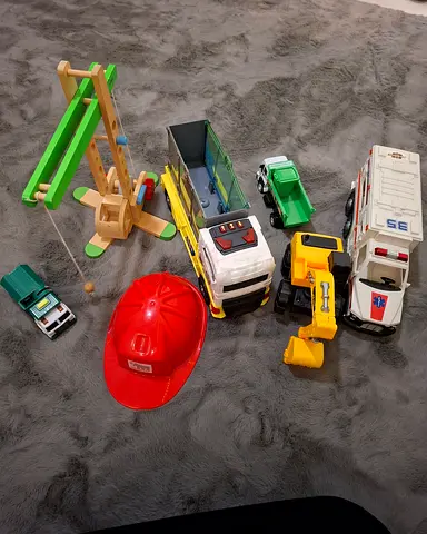 Mixed kids toy vehicles set with wooden crane and firefighter helmet