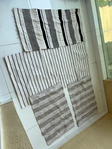 Set of 4 assorted flatweave rugs — neutral black, white and grey tones