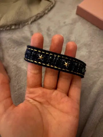 Black leather bracelet with gold star studs