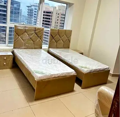 Pair of single beds with padded headboards - good condition