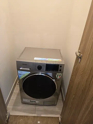 Silver front-load washing machine - good condition