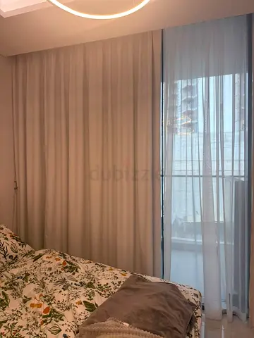 Neutral floor-to-ceiling bedroom curtains with sheer panel - good condition