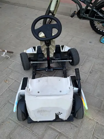 Kids battery-powered ride-on go-kart — white, used, works perfectly.