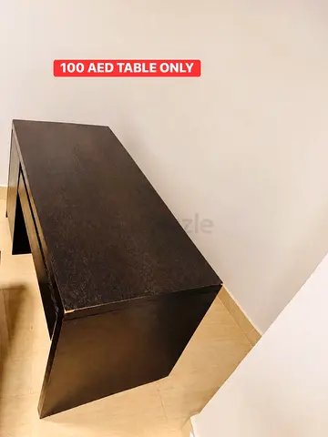 Simple dark wooden table - sturdy, good condition (100 AED)