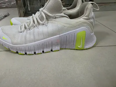 Lightweight white Nike running shoes, size 44.5, gently used
