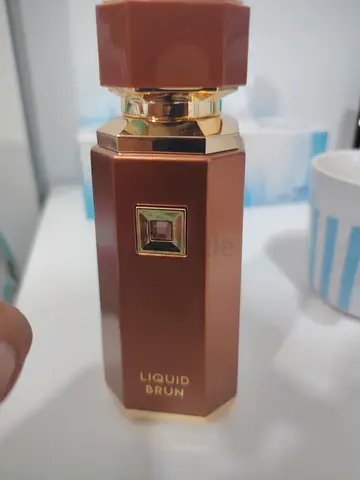 Liquid Brun perfume bottle - almost new, brown/gold