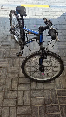 Used blue 24-inch mountain bike - good condition