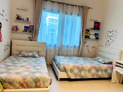 Two teens spacious bed with white leather headboard