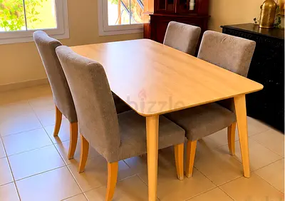 Light wood dining table with 4 chairs and matching set of side tables
