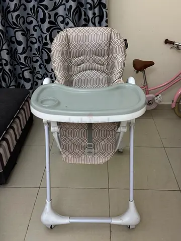 Gently used baby high chair with removable tray and reclining seat