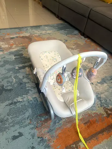 Baby rocker/bouncer seat with toy bar - light grey, gently used