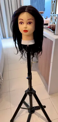 Natural black Hairdressing mannequin head with adjustable tripod stand.
