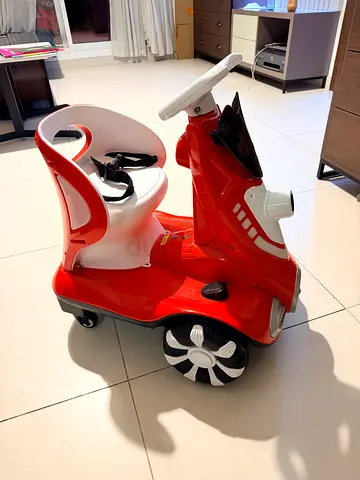 Red toddler ride-on car with parent handle — used, good condition ,with a free bike (tri cycle)