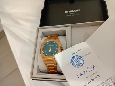 D1 Milano gold-tone men's wristwatch with original box and warranty