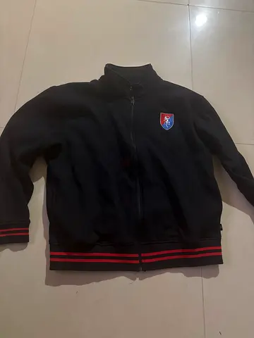 Gems Founders Black zip-up casual jacket with red stripe hem, size approx M