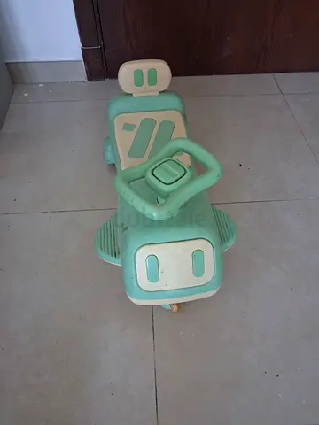 Green plastic ride-on toy car for toddlers up to 4 years old - good used condition.