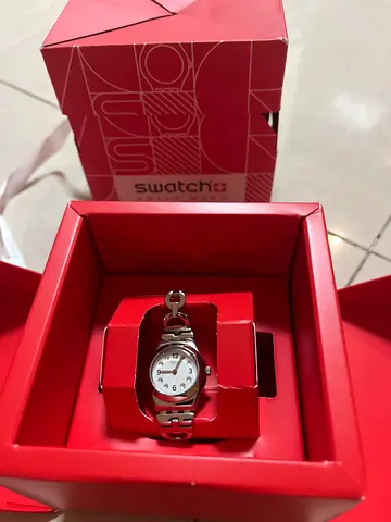 Swatch women's silver bracelet watch in original box - brand new