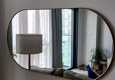 Large organic-shaped gold wall mirror