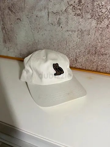 OVO October's Very Own white dad cap, owl logo