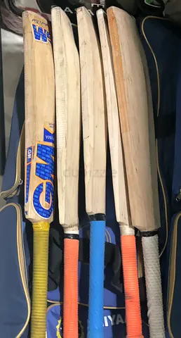 Set of 5 used cricket bats - various brands and grip colours