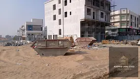 Residential/commercial land for sale in Al Amerah, Ajman. Prime location opposite Azhai Mall, first