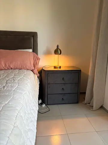 2 Grey velvet bedside table with three drawers and glass top