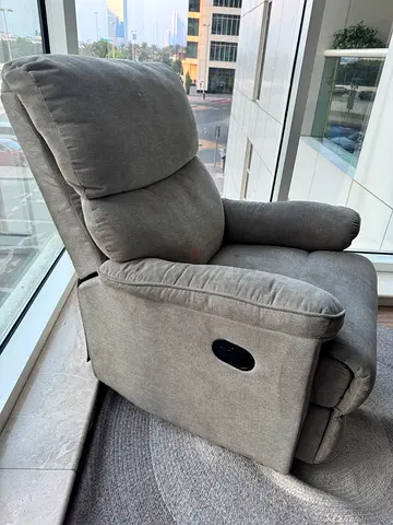 Grey fabric single recliner armchair - good condition