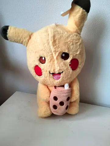 Pikachu plush toy holding bubble tea - soft stuffed animal
